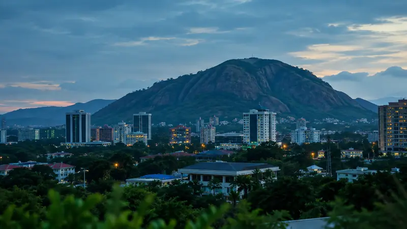 Abuja skyline at dusk with Aso Rock